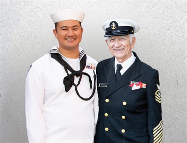 Young sailor of today with WWII veteran Nicholas Karthas